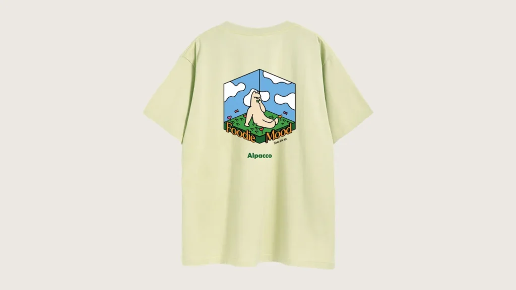 Local streetwear brand malaysia: Alpacco "Foodie Mood" tee in pistachio light green, back with alpaca mascot illustration in an isometric room