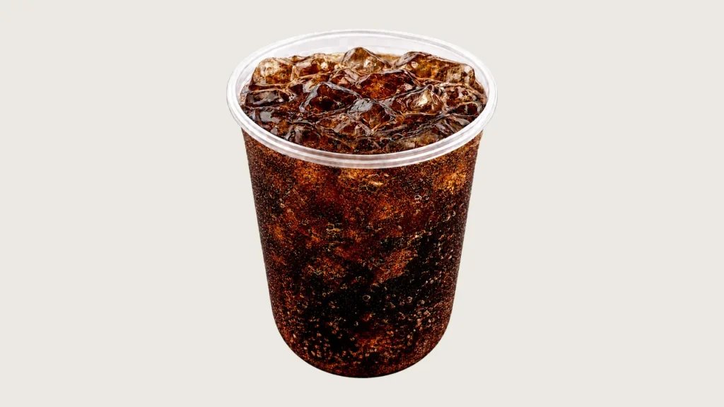 Sarsaparilla float klang: iced fizzy cola drink in a clear cup (no logo)