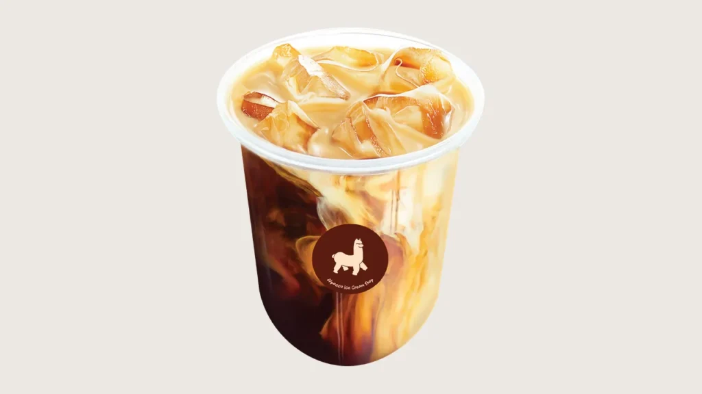 Latte vs cappuccino vs mocha: Alpacco iced latte with milk swirling through coffee