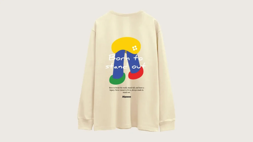 Long sleeve t shirt malaysia: Alpacco Signature Cotton Long Sleeve 250gsm tee in cream, back with colourful "Born to Stand Out" graphic