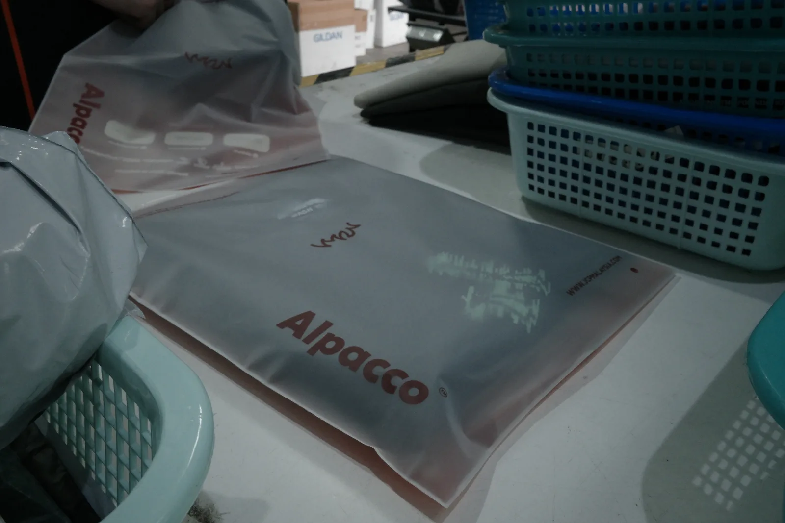 Alpacco branded garment bag used to pack Alpacco tees